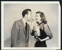 Dick Powell and Peggy Dow in a publicity still for You Never Can Tell