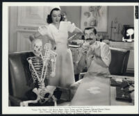 Lillian Cornell and Jerry Colonna pose with a skeleton in You're The One