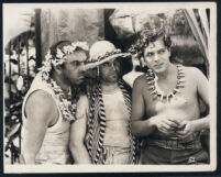 Warner Baxter with unidentified actors in a scene from Aloma of the South Seas