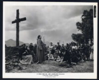Thomas Gomez, portraying Father Bartolome, surrounded by extras in Captain From Castile