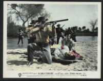 Guy Madison, Helen Westcott and cast members in a scene from The Charge at Feather River