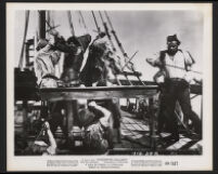 Cast members in a scene from Christopher Columbus