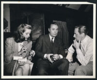 Lauren Bacall, Charles Boyer, and George Coulouris on the set of Confidential Agent