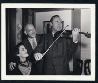 Unidentified actress, Herman Shumlin, and Charles Boyer on the set of Confidential Agent