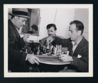 Charles Boyer, Herman Steiner, and Humphrey Bogart on the set of Confidential Agent
