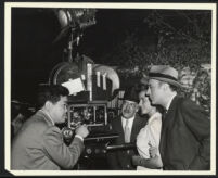 James Wong Howe, Herman Shumlin, Rosemary Sharples, and Charles Boyer on the set of Confidential Agent