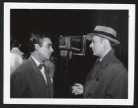 Unidentified man and Charles Boyer on the set of Confidential Agent