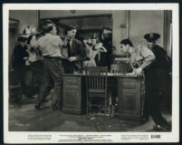 Cast members in a scene from Detective Story