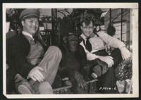 Andy Devine and Rufe Davis posing with Jiggs the chimp on the set of Doctor Rhythm.