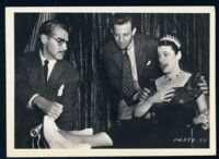 Frank Tuttle and an assistant help Beatrice Lillie on the set of Doctor Rhythm.