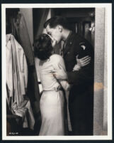 Leslie Caron and John Kerr embrace with a passionate kiss in Gaby