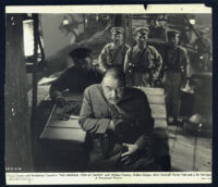 Akim Tamiroff and cast members aboard a Chinese junk in The General Died at Dawn