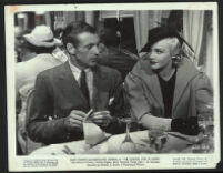 Gary Cooper, John O'Hara, Madeleine Carroll and cast members dining on a train in The General Died at Dawn