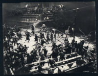 Errol Flynn and crowd disperse after police raid boxing match on a barge in Gentleman Jim
