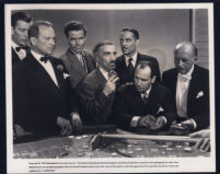 Glenn Ford, Joseph Calleia, and extras in a gambling scene from Gilda