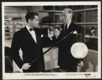 Glenn Ford and George Macready in a scene from Gilda