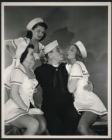 William Bendix surrounded by carhops Virginia Linden, Jonni Paris and Sue Carlton in a scene from A Girl in Every Port