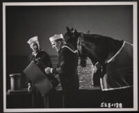 Groucho Marx and William Bendix lead a horse in A Girl in Every Port