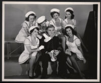 William Bendix surrounded by female co-stars playing car-hops in A Girl in Every Port