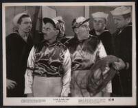 Groucho Marx, William Bendix, and extras in a scene from in A Girl in Every Port