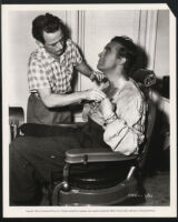 Ray Milland and production crew member in Golden Earrings