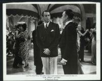 Macdonald Carey with an unidentified actor and extras in The Great Gatsby