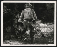 Jack Kelly and other cast members in Gunsmoke