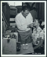 Judy Walsh getting made up by Don Cash for The Half-Breed