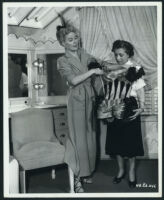 Janis Carter inspects wadrobe for The Half-Breed