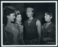 Jack Buetel with showgirl extras on the set of The Half-Breed