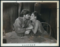 John Bromfield and Alyce Louis share a moment in Harpoon