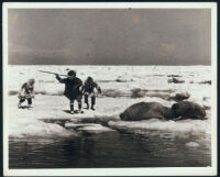 Three Eskimos on a walrus hunt in a scene cut from the film Harpoon