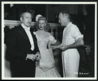 Adolphe Menjou, Ginger Rogers, and director Sam Wood on the set of Heartbeat