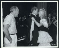 Director Sam Wood watches Jean Pierre Aumont dance with Ginger Rogers in Heartbeat