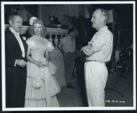 Adolphe Menjou, Ginger Rogers, and director Sam Wood on the set of Heartbeat