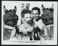 Nancy Coleman and Philip Reed with Mardi Gras costumes in a publicity photograph for Her Sister's Secret