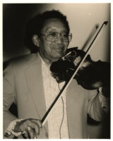 Claude "Fiddler" Williams playing the violin in Los Angeles [descriptive]