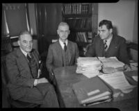 Maj. Donald H. Connolly, C.W.A. director of Los Angeles County, meets with Peirson M. Hall and Capt. Edward Macauley, circa February 1934.