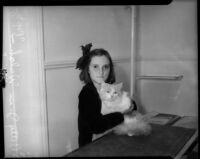 "Pop-eye," a brave Persian housecat, and his owner Betty Jean Welch.