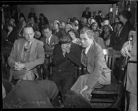 Louis Rude Payne, with father Lucius Payne at his side, at his inquest for the murder of his mother and brother.  June 6, 1934.