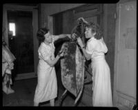 Women employed by SERA work with a wheelbarrow, Los Angeles, circa 1934