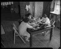 Women employed by SERA sew a quilt, Los Angeles, circa 1934