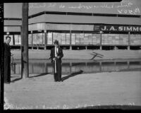 Armed guard with artificial moat at lettuce packing plant, Los Angeles, 1934