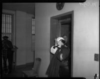 Ann Forst walks into county jail after being charged for operating a prostitution ring, Los Angeles, 1940