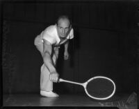 Badminton pro Jess Willard poses with his racket, Los Angeles, 1935