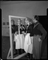 La Boheme performer applies make-up at the Shrine Auditorium, Los Angeles, 1935