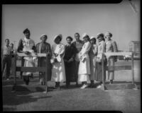 Jesse Owens pictured with a group of unidentified African American women, Los Angeles, 1930s