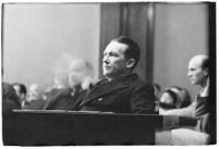 Widower Robert S. James sitting in a courtroom during an inquest involving his wife's death, Los Angeles, 1935