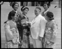 Miss Lil Tokio Alice Watanabe extends an invitation to Mayor Frank L. Shaw for the annual Nsei festival, Los Angeles, 1935