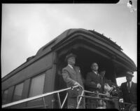 President Franklin D. Roosevelt and Eleanor Roosevelt greet the crowd from his train at Central Station, Los Angeles, October 1, 1935